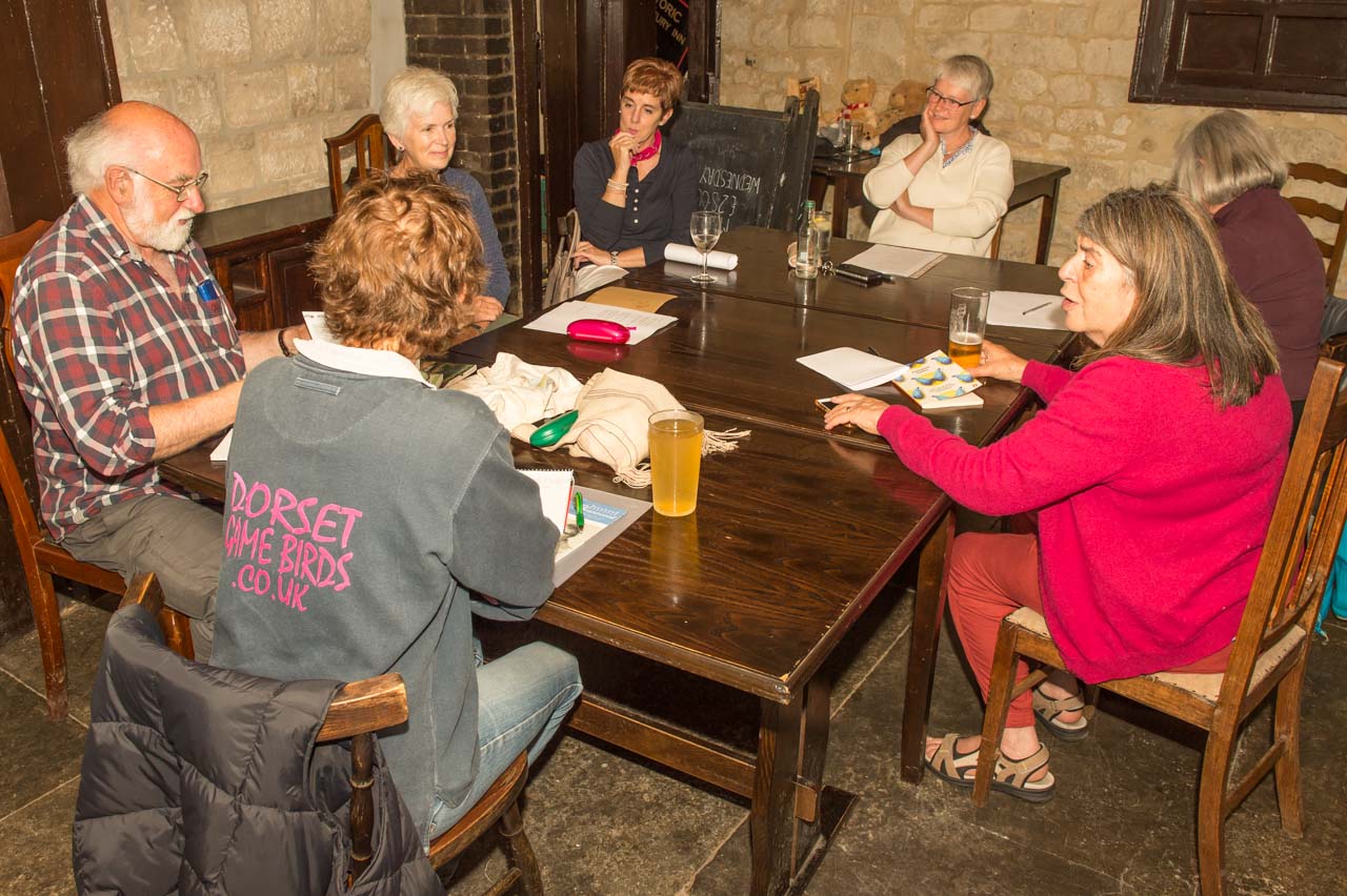 A meeting of the Poetry Group, in the Oak Room of the Fox and Hounds